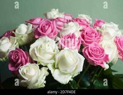 Roses posy over green background, closeup shot Stock Photo