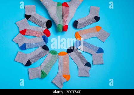 colored socks in a around on a blue background Stock Photo