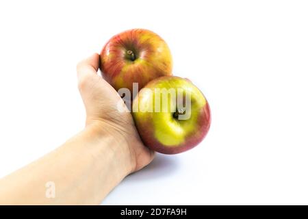 Demonstration of red apples in hand on white isolated background Stock Photo