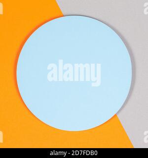 Abstract geometric texture background of soft light blue, pastel gray and orange color paper. Top view, flat lay Stock Photo