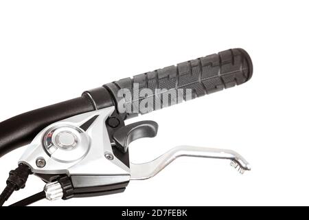 Fragment of a bicycle handlebar with brake lever and gear shift isolated on white background. Stock Photo