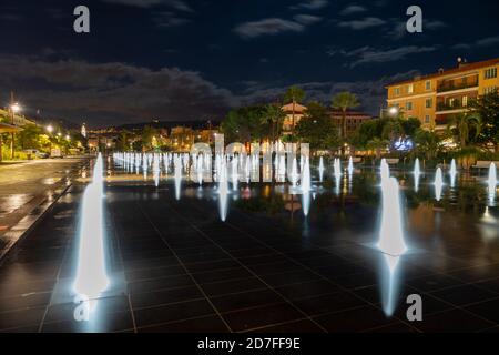 NICE, FRANCE - NOVEMBER 25, 2015: Dancing fountains in Promenade du Paillon in the evening in Nice, French Riviera Stock Photo