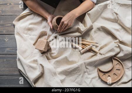 Table with materials and tools for pottery making craftsperson workspace creative studio top view Stock Photo