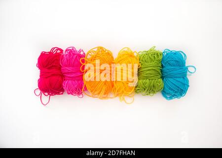 multicolored balls with yarn on a white background Stock Photo
