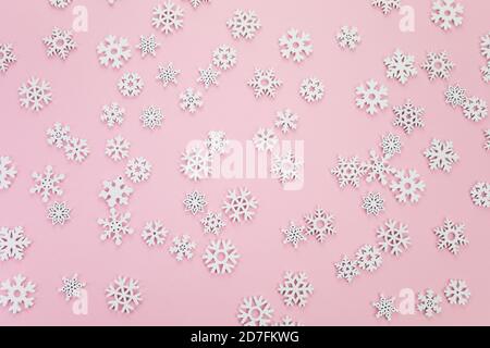 Snow flakes pattern on pink background. Top view Stock Photo