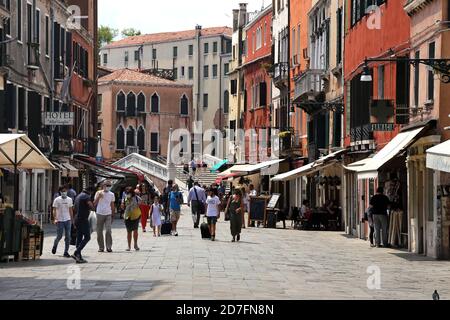 Venice, Italy. June 24, 2020. First tourists walking on a street of Venice historic centre city after the Italian lockdown for the covid-19 pandemic c Stock Photo