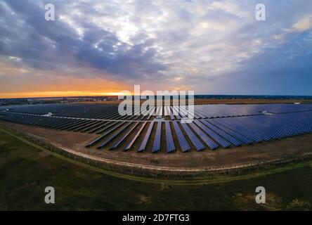 Aerial panorama view of large solar panels at a solar farm at bright ...