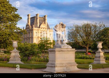 Good Samaritan Statue - Le Bon Samaritain, in Jardin des Tuileries with Musee du Louvre beyond, Paris France Stock Photo