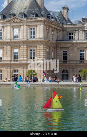 Toy sailboats in the pond below Palais du Luxembourg, Paris, Ile-de-France, France Stock Photo