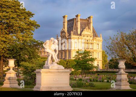 Good Samaritan Statue in Jardin des Tuileries with Musee du Louvre beyond, Paris France Stock Photo