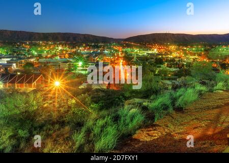 night view of Alice Springs skyline in Australia from Anzac Hill Memorial lookout with main buildings of Alice Springs city downtown. Red Centre Stock Photo