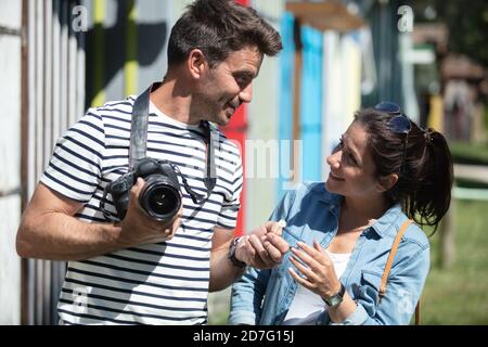 miling couple with photo camera in the city Stock Photo