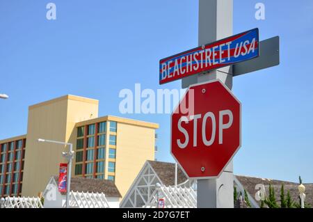 Beach Street USA Sign and Stop Sign in Virginia Beach Oceanfront in Virginia Beach, Virginia, USA. Stock Photo