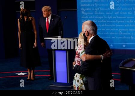 Nashville, United States. 22nd Oct, 2020. Democratic presidential candidate former Vice President Joe Biden hugs wife Jill Biden as President Donald Trump stands with first lady Melania Trump after the final presidential debate at Belmont University on Thursday, October 22, 2020 in Nashville, Tennessee. This is the last debate between the two candidates before the election on November 3. Pool Photo by Morry Gash/UPI Credit: UPI/Alamy Live News Stock Photo