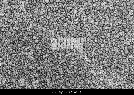 Black color styrofoam texture background. Close-up macro view of abstract plastic material pattern. Stock Photo