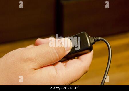High angle shot of hand pressing the remote shutter of the camera Stock Photo