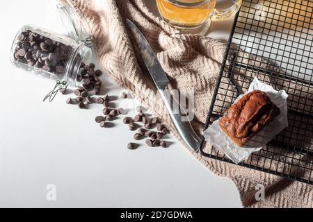 Mini chocolate chip pumpkin loaf with a glass of tea Stock Photo