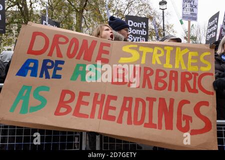 Don’t bomb Syria demonstration, organised by the Stop the War Coalition. The demonstration is in response to likely vote in Parliament in the next week over whether Britain should join the bombing campaign against Islamic State in Syria. The vote is in response to the recent Islamic State terrorist attack in Paris, Downing Street, Westminster, London, UK.  28 Nov 2015 Stock Photo