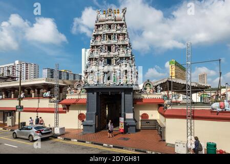 Singapore - December 4, 2019: Street view of Chinatown Singapore at sunny day with Sri Mariamman Hindu Temple in the heart of Singapore's old Chinatow Stock Photo