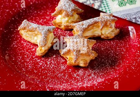 Close up of a variation of Christmas Pastries  on a red plate Stock Photo