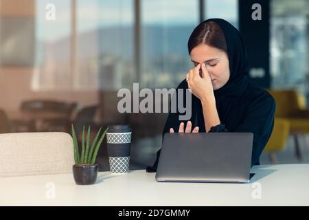 professional young female muslim worker having problem Stock Photo