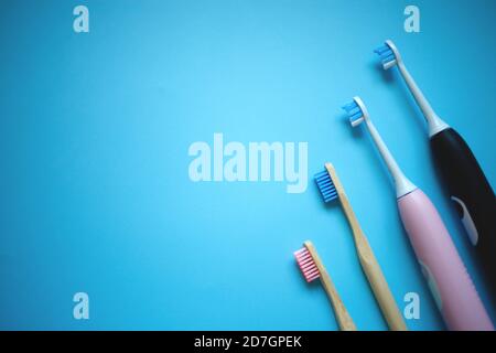 two ultrasonic electric toothbrushes on a blue background Stock Photo