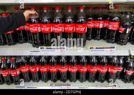 Bottles of Coca-Cola in a retail display Stock Photo - Alamy