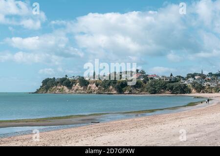 AUCKLAND, NEW ZEALAND - Sep 10, 2019: Auckland / New Zealand - September 10 2019: View of St Heliers Bay suburb with waterfront houses on hill in back Stock Photo