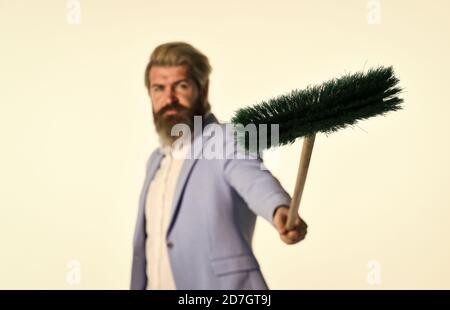 Global crisis and unemployment. Qualified. Personnel shifts. New responsibilities. Demotion concept. Crisis and unemployment. I agree to any work. Businessman hold broom. Financial crisis concept. Stock Photo