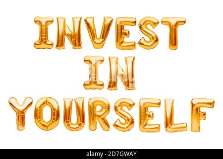 Words Invest In Yourself made of golden inflatable balloons isolated on white. Helium gold foil balloons forming text. Improve your skills, self Stock Photo