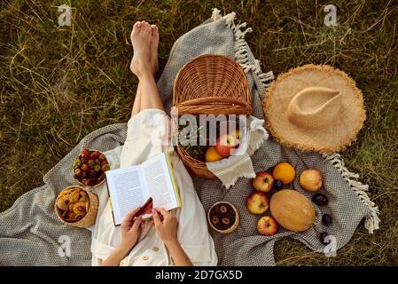 Girl resting on picnic in summer.