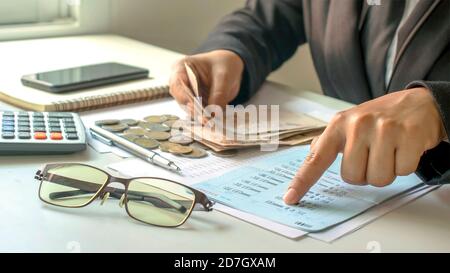 Businessman checking accounts and business income, the concept of financial management and financing. Stock Photo