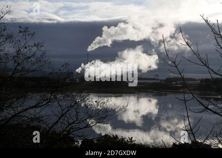 Shewalton, North Ayrshire, Scotland, UK ,Caledonian Paper Mill,  Steam from the mill reflecting in water Stock Photo