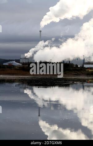 Shewalton, North Ayrshire, Scotland, UK ,Caledonian Paper Mill,  Steam from the mill reflecting in water Stock Photo