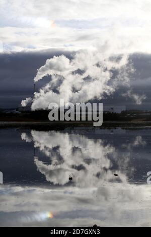 Shewalton, North Ayrshire, Scotland, UK ,Caledonian Paper Mill,  Steam from the mill reflecting in water Stock Photo