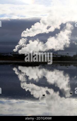 Shewalton, North Ayrshire, Scotland, UK ,Caledonian Paper Mill,  Steam from the mill reflecting in water Stock Photo