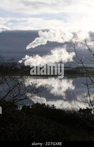 Shewalton, North Ayrshire, Scotland, UK ,Caledonian Paper Mill,  Steam from the mill reflecting in water Stock Photo