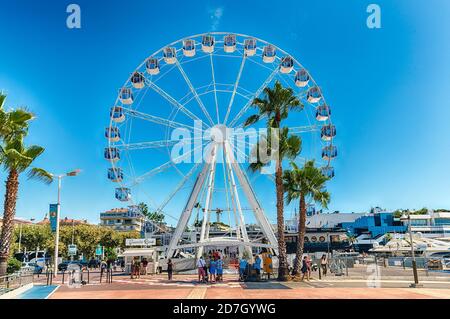 CANNES, FRANCE - AUGUST 15: View over the Panoramic Ferris Wheel in Cannes, Cote d'Azur, France, as seen on August 15, 2019. It is located on the back Stock Photo