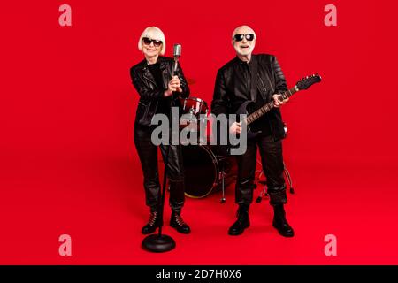 Full size photo of two people white grey hair retired pensioner woman vocalist man bass guitar player enjoy practice stage event tour performance Stock Photo