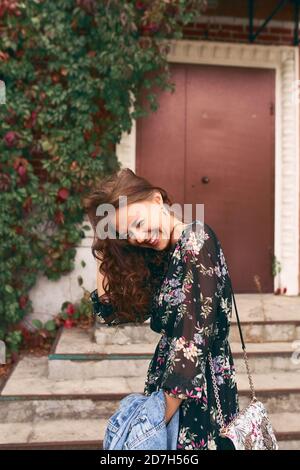 Happy smiling caucasian young woman in dress Stock Photo