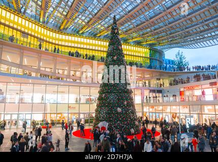 Christmas tree under the canopy, Châtelet Les Halles, Paris, France. Beautiful giant pine tree in the center of the mall. Santa Klaus. Stock Photo