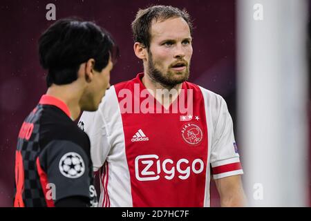 AMSTERDAM, NETHERLANDS - OCTOBER 21: Takumi Minamino of Liverpool FC, Daley Blind of Ajax during the UEFA Champions League match between Ajax and Liverpool at the Johan Cruijff Arena on October 21, 2020 in Amsterdam, Netherlands (Photo by Gerrit van Keulen/Orange Pictures) Stock Photo