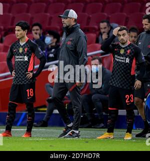 AMSTERDAM, NETHERLANDS - OCTOBER 21: Takumi Minamino of Liverpool FC, Head Coach Jurgen Klopp of Liverpool FC, Xherdan Shaqiri of Liverpool FC, 4th official Daniel Siebert during the UEFA Champions League match between Ajax and Liverpool at the Johan Cruijff Arena on October 21, 2020 in Amsterdam, Netherlands (Photo by Gerrit van Keulen/Orange Pictures) Stock Photo