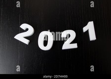White numbers 2021 on black background, new year Stock Photo