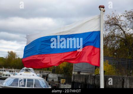 The Russian flag, growing in the wind. Flag of the Russian Federation Stock Photo