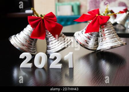 White 2021 Numbers and New Year Bells closeup Stock Photo