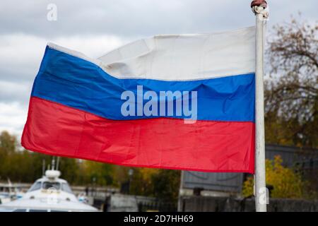 The Russian flag, growing in the wind. Flag of the Russian Federation Stock Photo