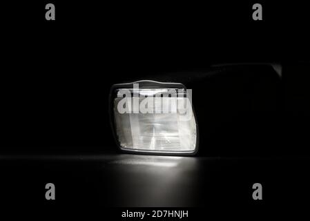 Flashlight head on black background in low key light Stock Photo