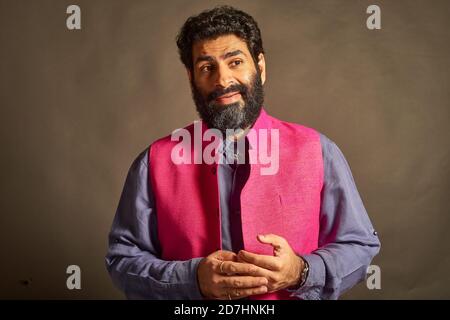 A young Indian man with a typical 'artist' and 'intellectual' look. Stock Photo