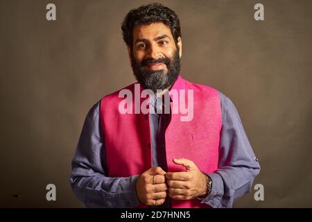 A young Indian man with a typical 'artist' and 'intellectual' look. Stock Photo